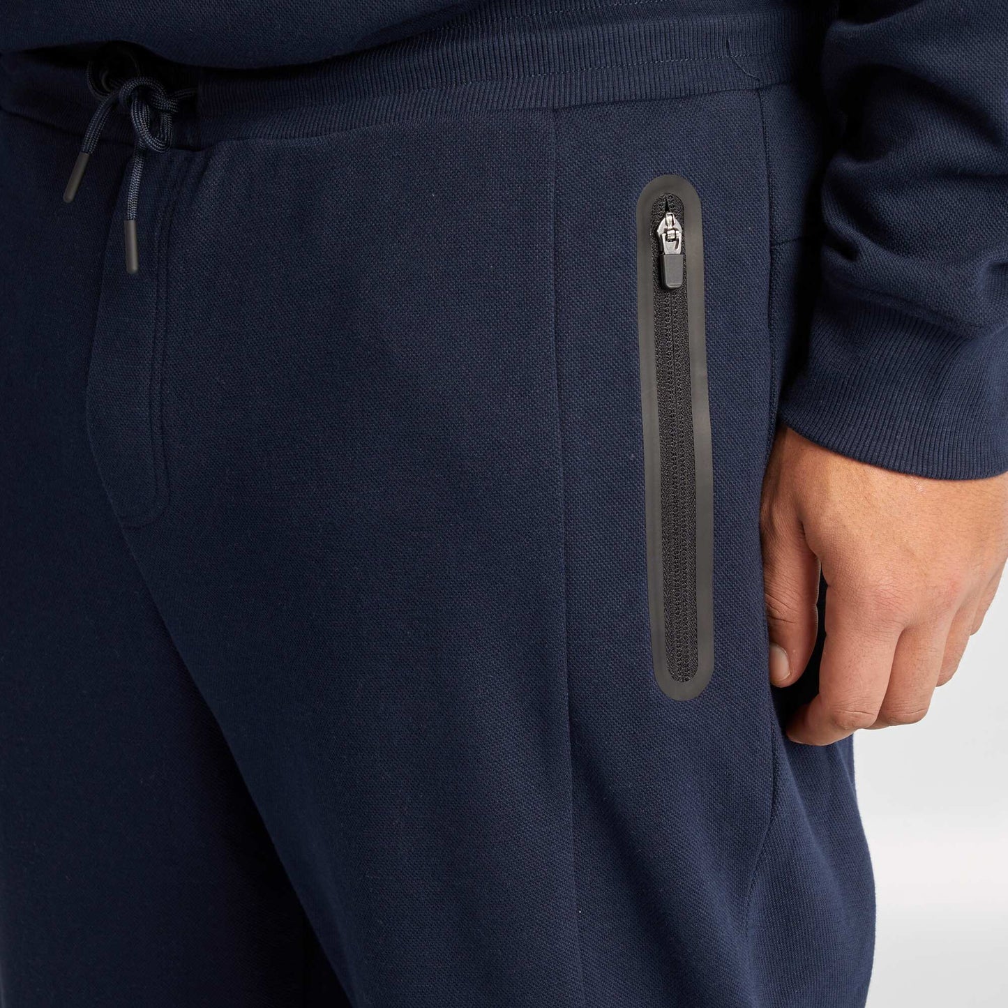 Pantalón de chándal de punto de piqué con bolsillos con cremallera AZUL