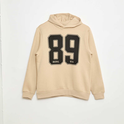 Buzo estampada con diseño fantasía en algodón liso BEIGE
