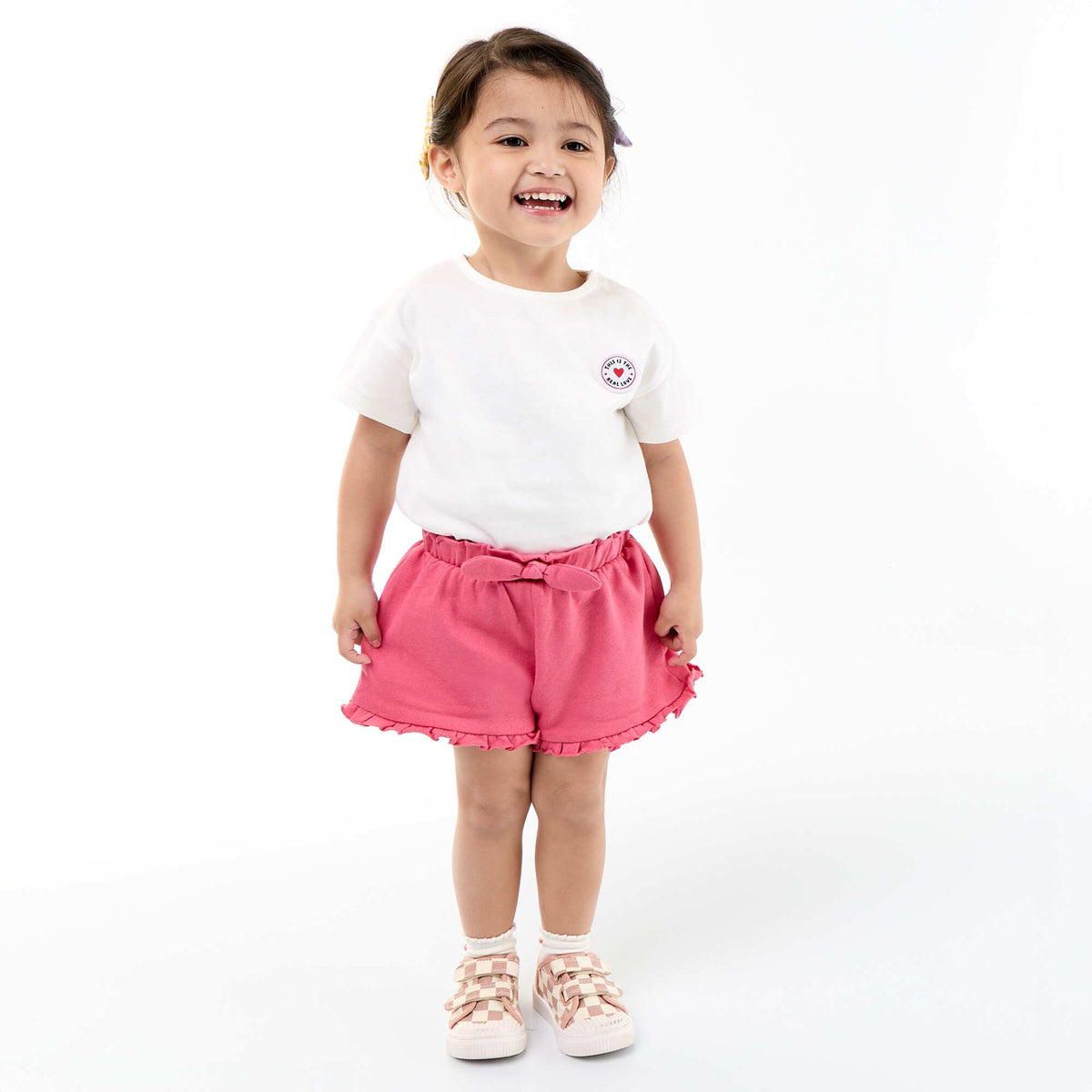 Pantalón corto con volantes y lazo en la cintura FUCSIA