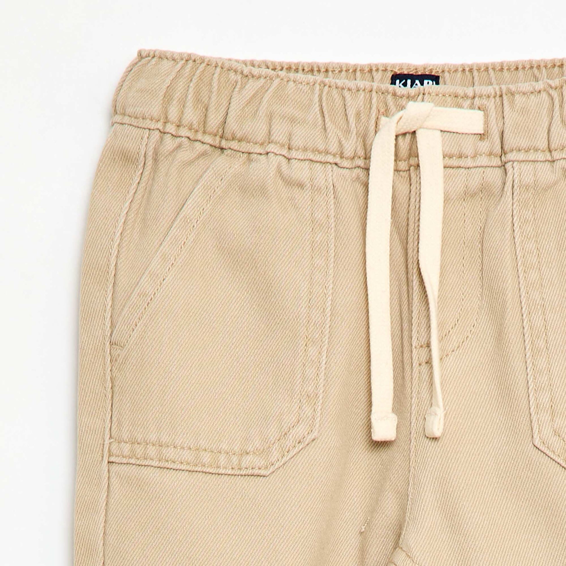 Pantalón liso corte relax fit BEIGE