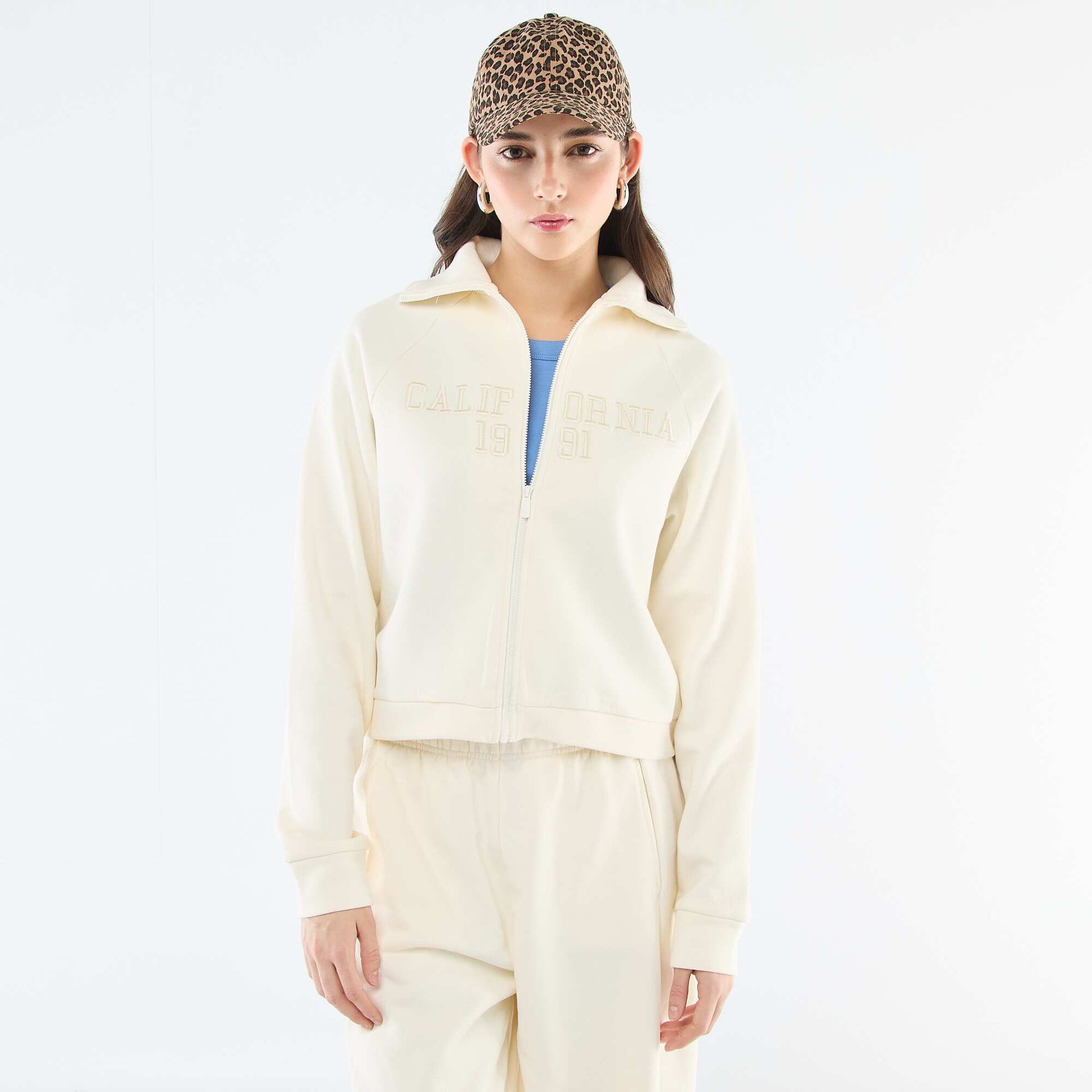 Buzo corta con cremallera y mensaje bordado BEIGE