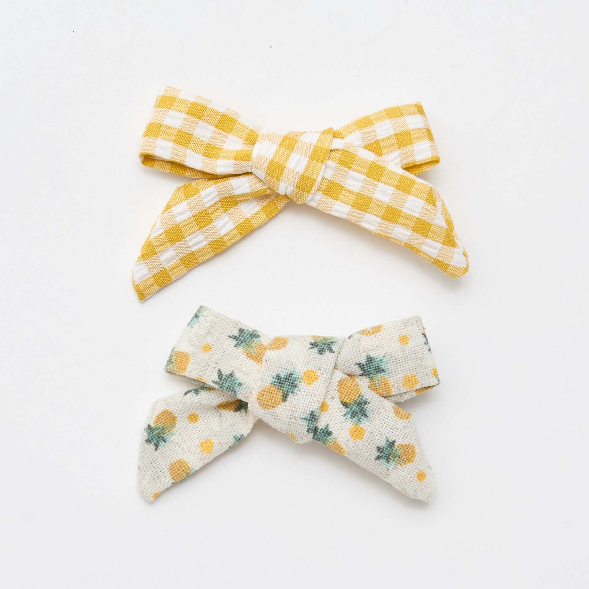Pack de 2 pinzas de cocodrilo con lazos AMARILLO