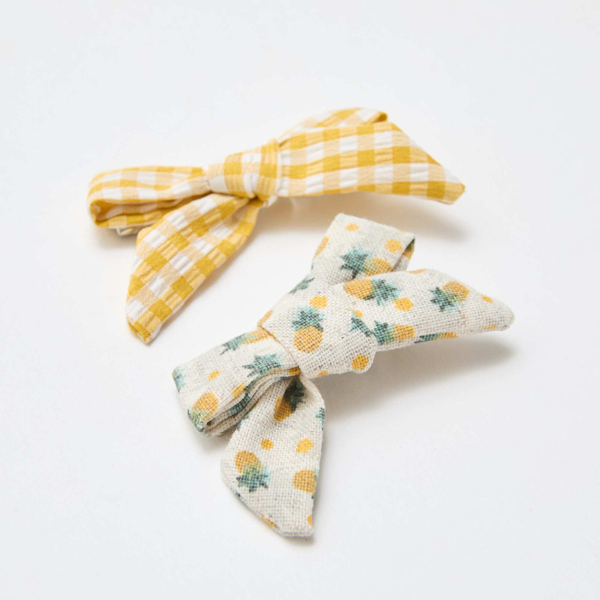 Pack de 2 pinzas de cocodrilo con lazos AMARILLO