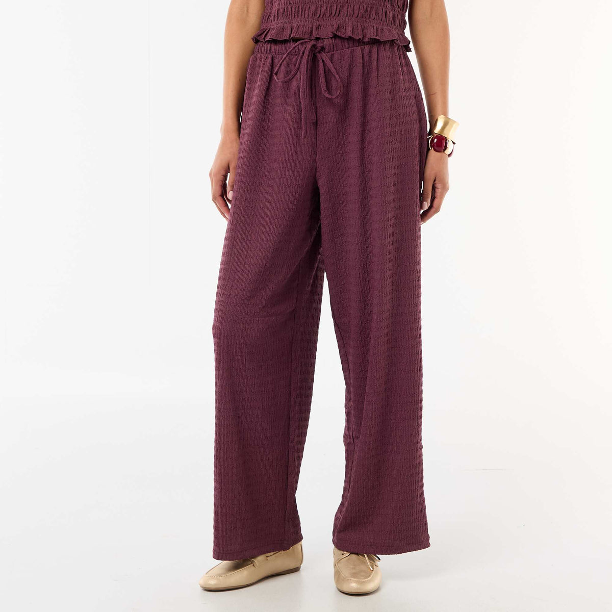 Pantalón ancho de punto smock PURPURA