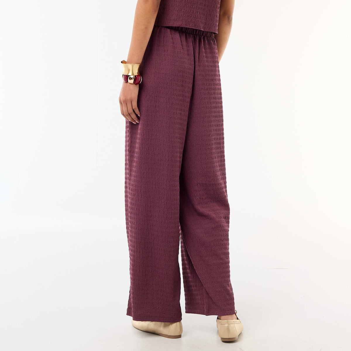 Pantalón ancho de punto smock PURPURA