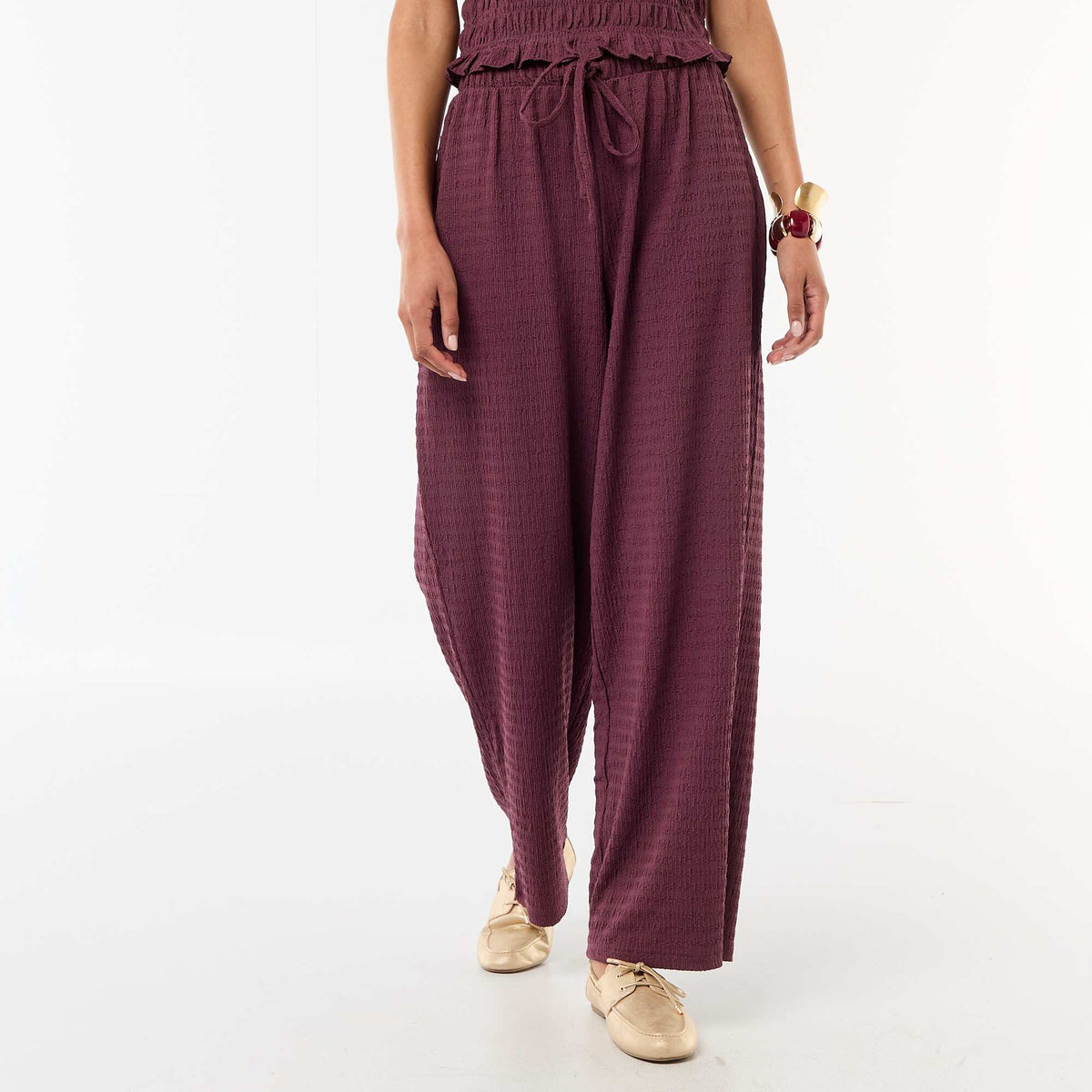 Pantalón ancho de punto smock PURPURA