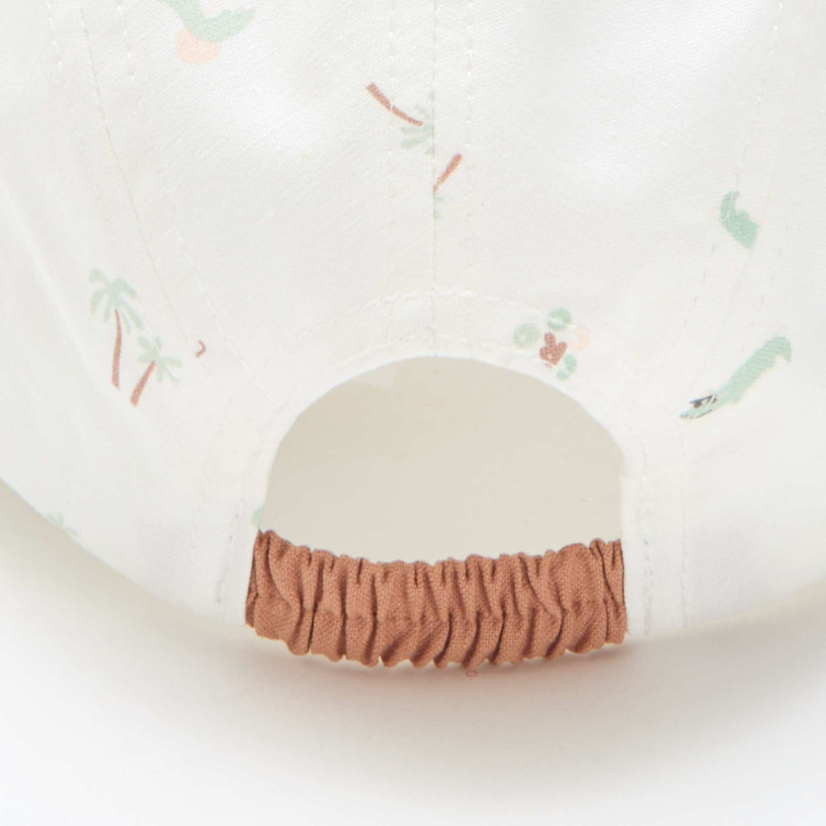 Gorra de tela con estampados BEIGE
